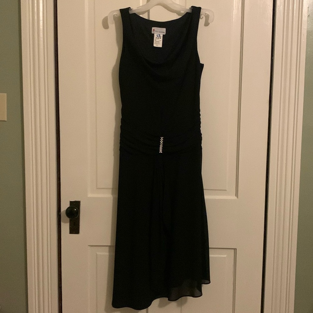 Black cocktail dress. Citi Clothing brand. Fully lined. Asymmetrical bottom.